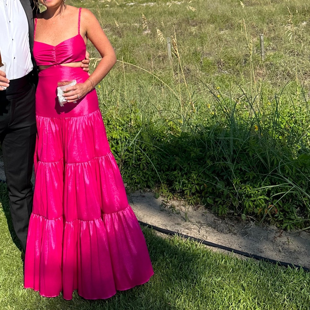 Elegant Black Suit and Vibrant Pink Dress